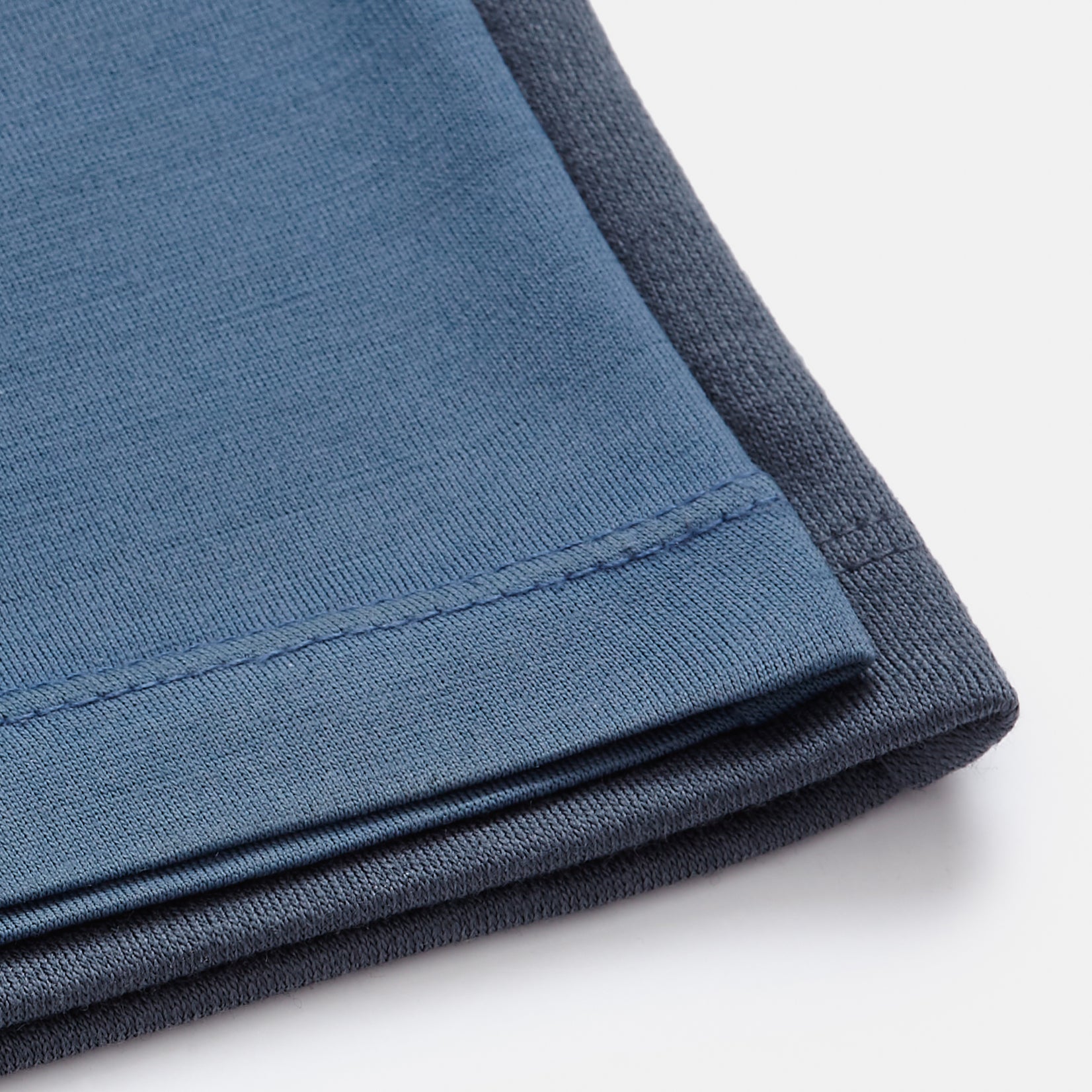 model-spec: Fabric weight comparison between our Lightweight Signature 160 Crew Neck Tee and our Heavyweight Interlock Crew Neck Tee. 
