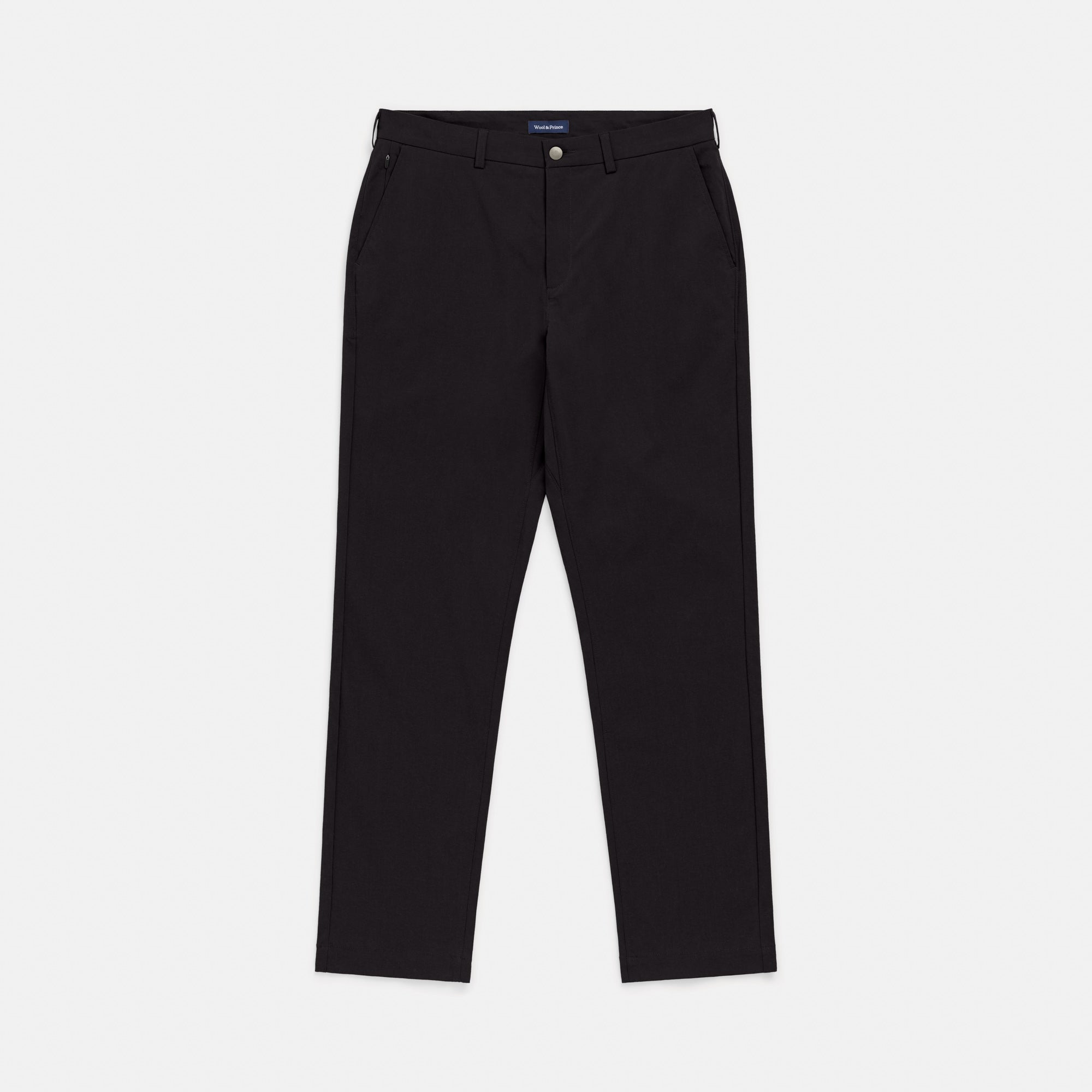 Laydown of merino wool Stretch Tech Chino Pant in Black. This is a straight fit pant available in sizes 30-38.