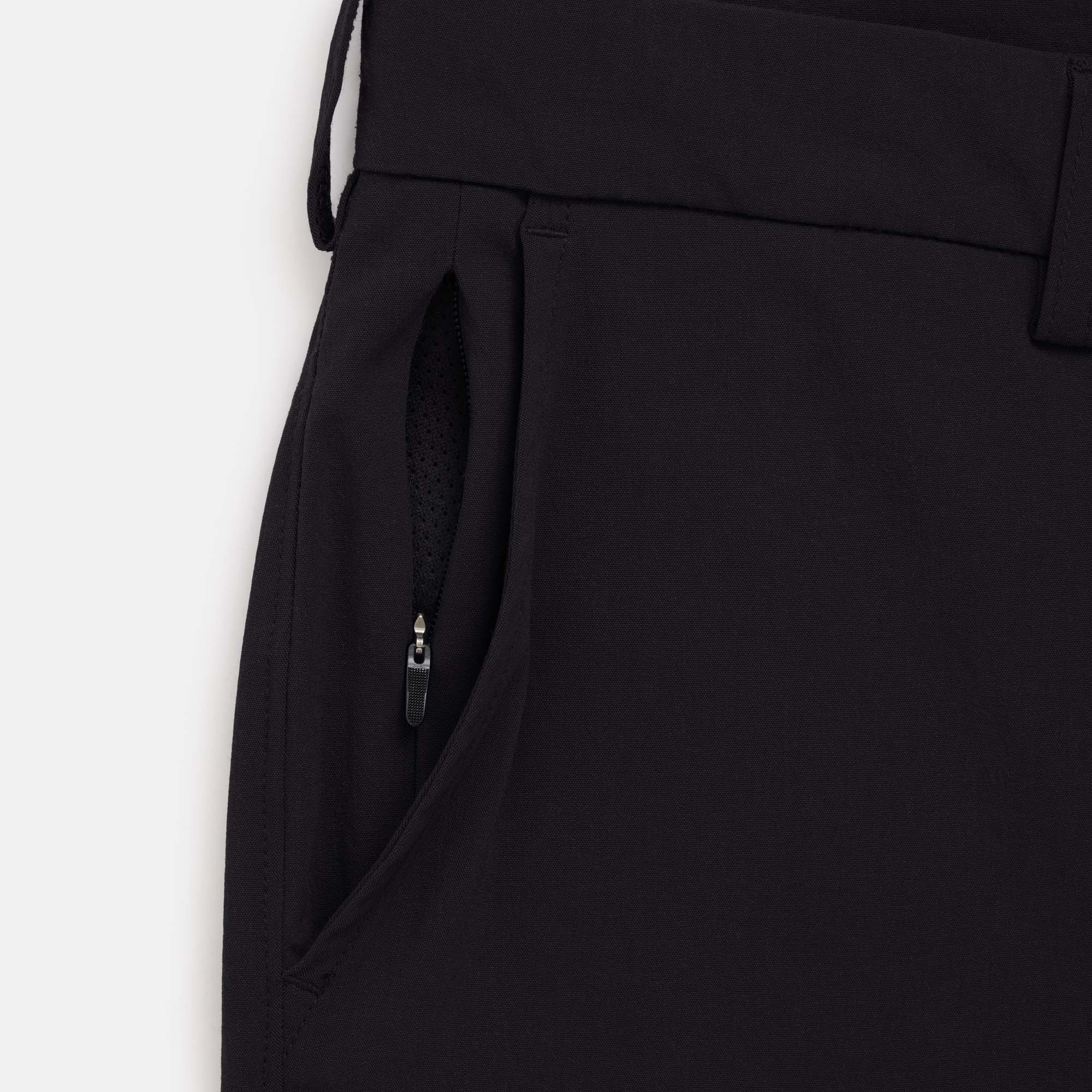 Detail of merino wool Stretch Tech Chino Pant in Black. This is a straight fit pant available in sizes 30-38.