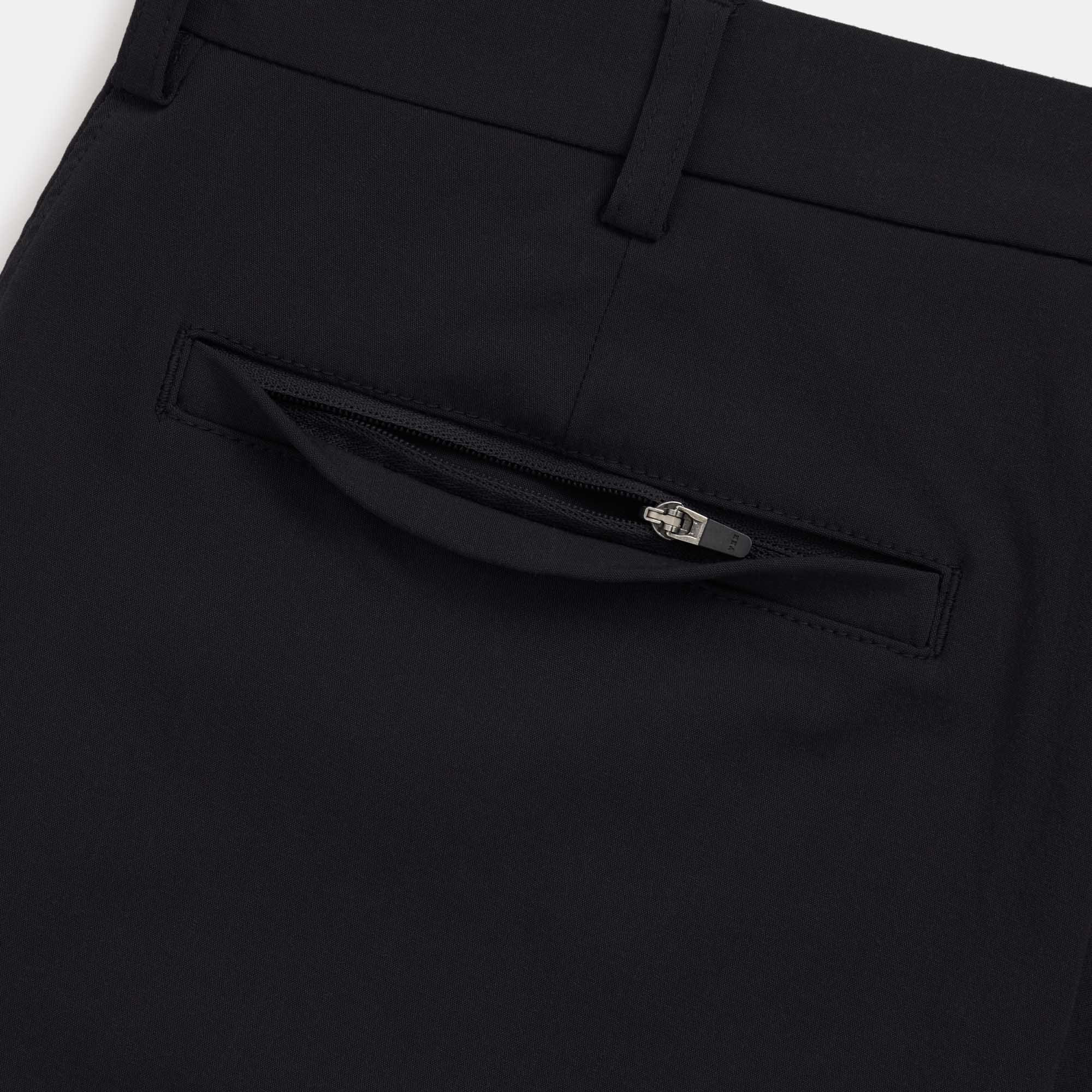 Detail of merino wool Stretch Tech Chino Pant in Black. This is a straight fit pant available in sizes 30-38.