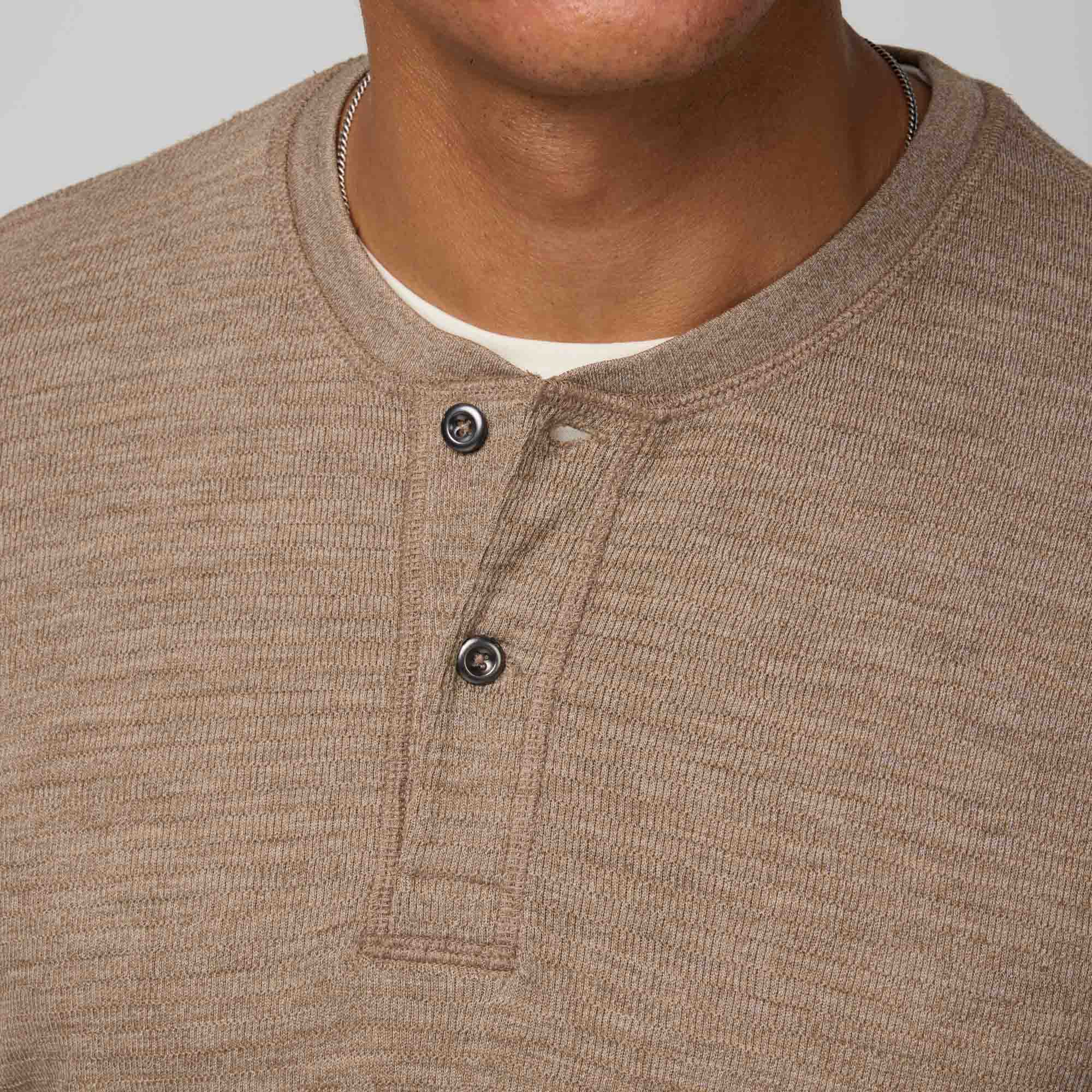 Detail of merino wool Waffle Henley in Cedarwood Heather, a textured taupe-brown. This is a long sleeve, crew neck henley shirt available in sizes XS-XXL.