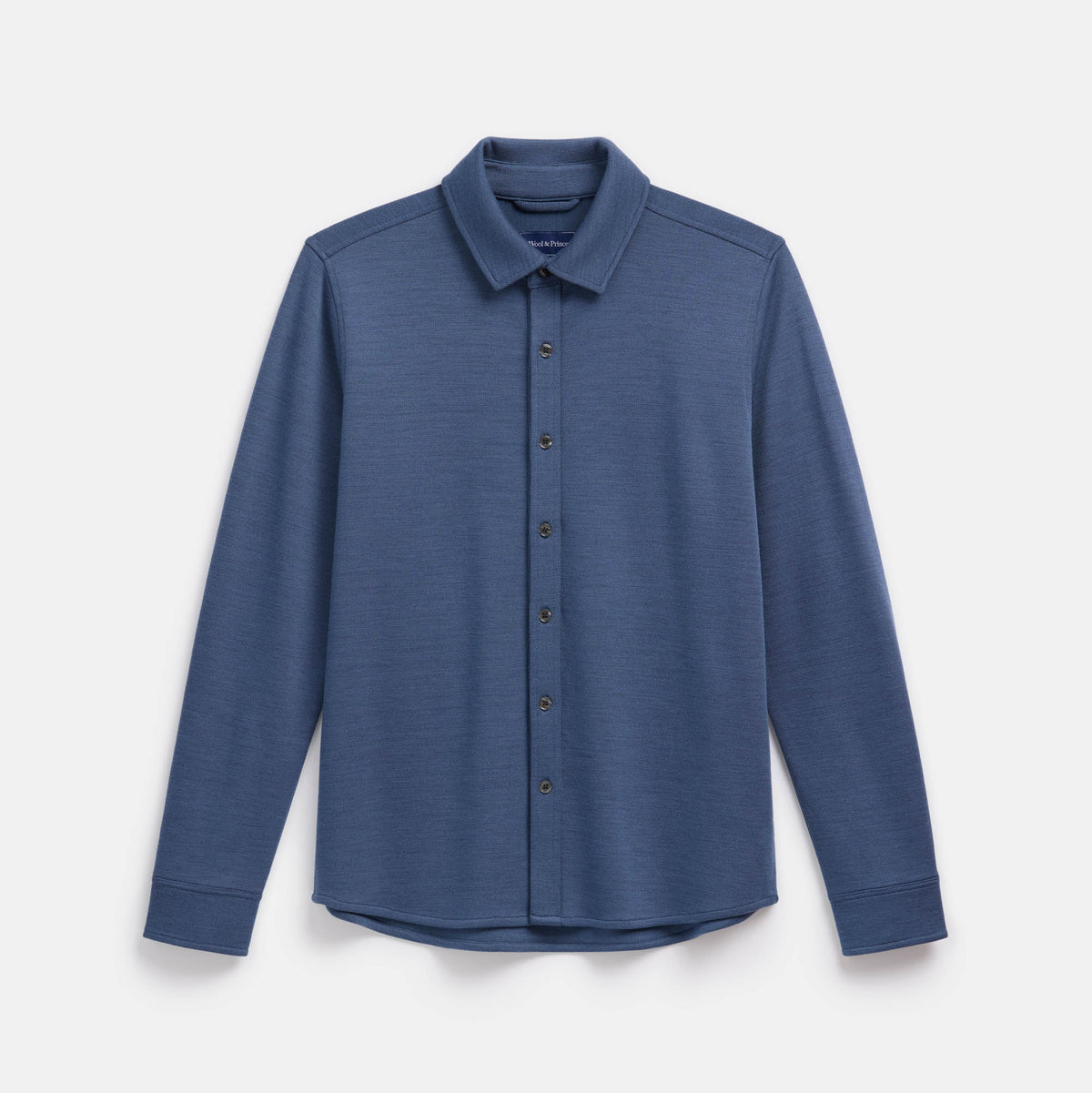 Laydown of merino wool Midweight Pique Button-Down Shirt in Vintage Blue, a medium blue color. This is a long sleeve, collared, casual button-down shirt available in sizes S-XXL.