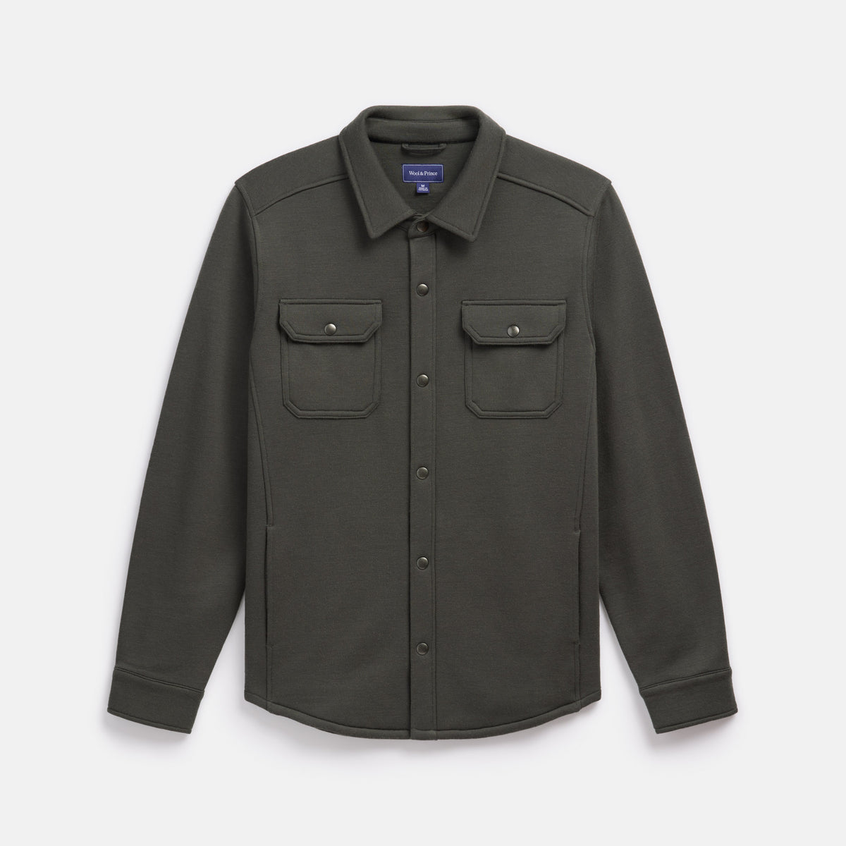 Laydown of Brushback Shacket in Forest Night, a dark forest green color. This is a 100% merino wool jacket available in sizes XS-XXL.