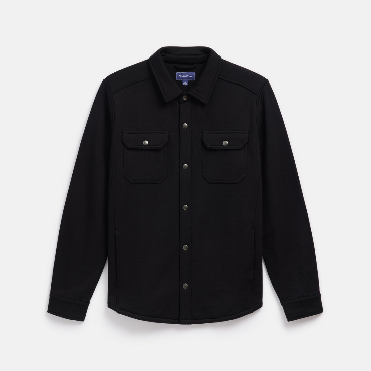 Laydown of Brushback Shacket in Black. This is a 100% merino wool jacket available in sizes XS-XXL.