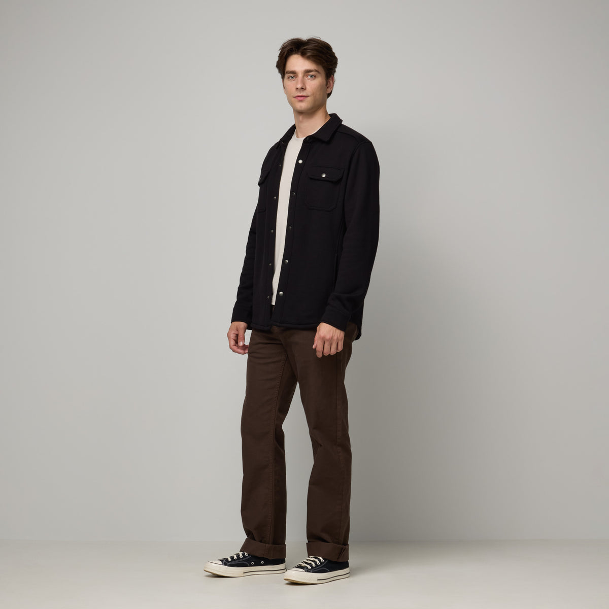 Model wearing Brushback Shacket in Black. This is a 100% merino wool jacket available in sizes XS-XXL.