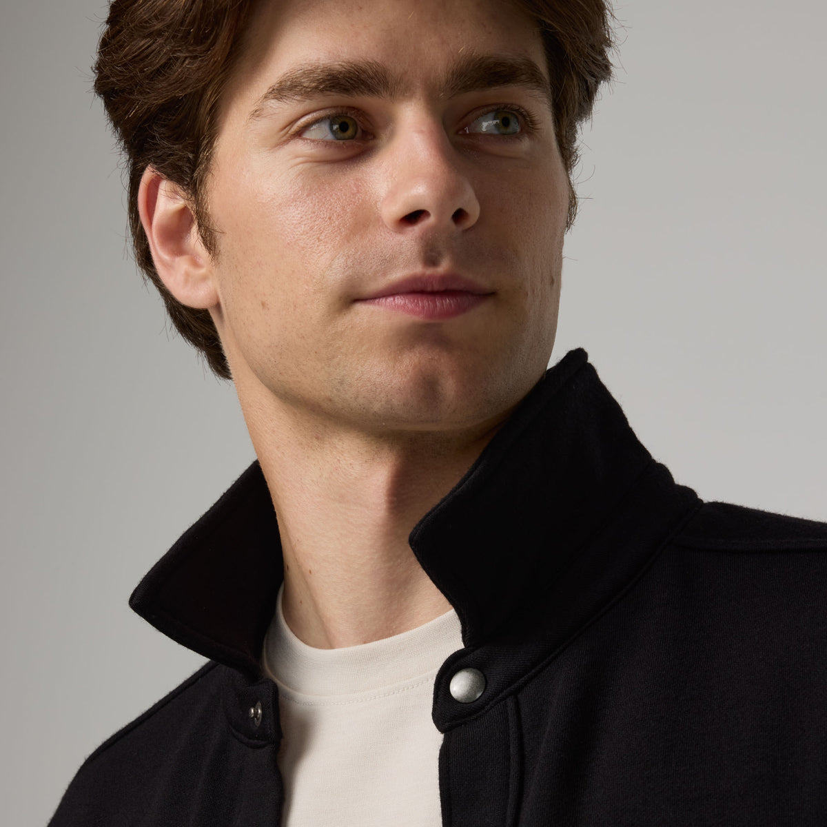 Model wearing Brushback Shacket in Black. This is a 100% merino wool jacket available in sizes XS-XXL.