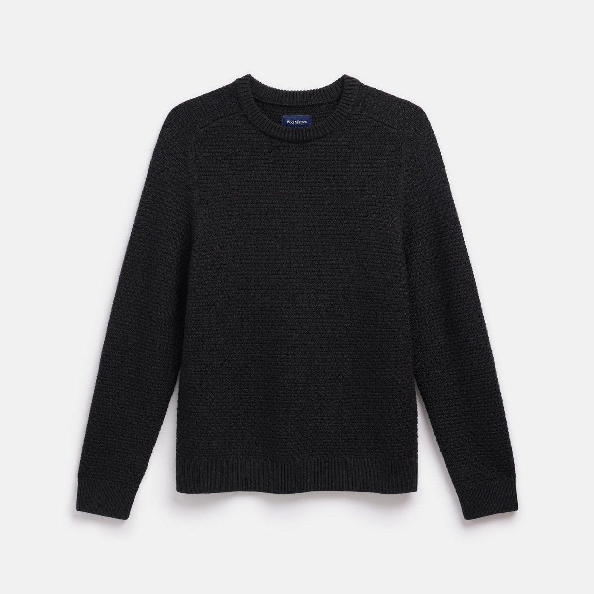 Laydown of 100% merino wool Textured Crew Neck Sweater in Black Heather, a dark gray color. This is a knit available in sizes S-XXL.